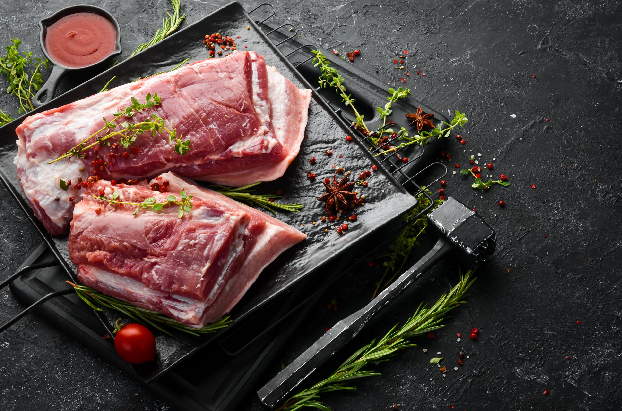 raw-pork-brisket-with-ingredients-spices-kitchen-background-meat-top-view-rustic-style (1)